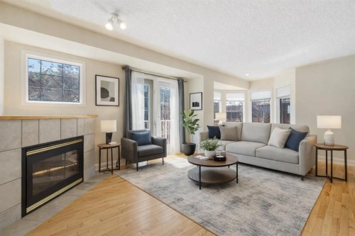 81 Prominence View Sw, Calgary, AB - Indoor Photo Showing Living Room With Fireplace