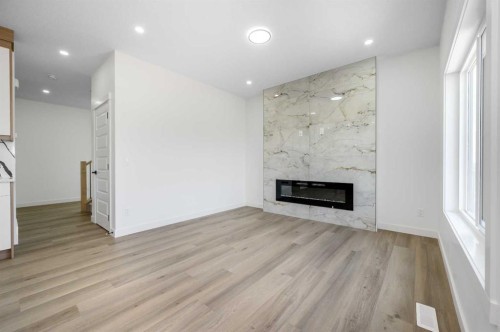182 Lakewood Crescent, Strathmore, AB - Indoor Photo Showing Living Room With Fireplace