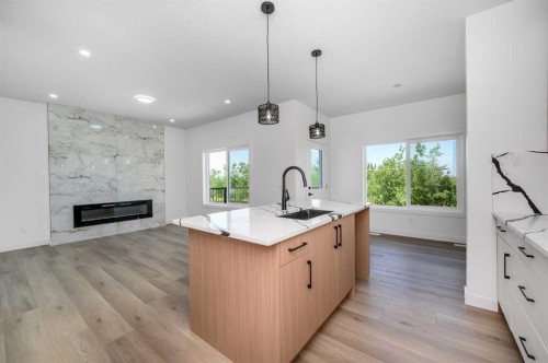 182 Lakewood Crescent, Strathmore, AB - Indoor Photo Showing Kitchen With Fireplace With Upgraded Kitchen