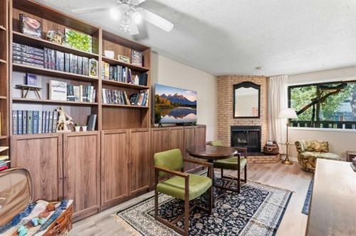 7341 36 Avenue Nw, Calgary, AB - Indoor With Fireplace