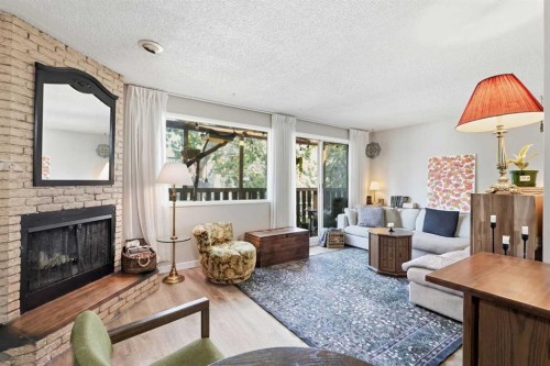 7341 36 Avenue Nw, Calgary, AB - Indoor Photo Showing Living Room With Fireplace