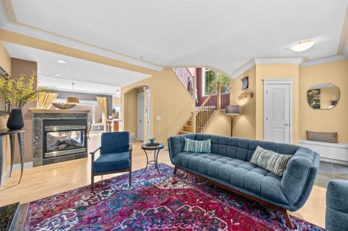 301 29 Avenue Ne, Calgary, AB - Indoor Photo Showing Living Room With Fireplace