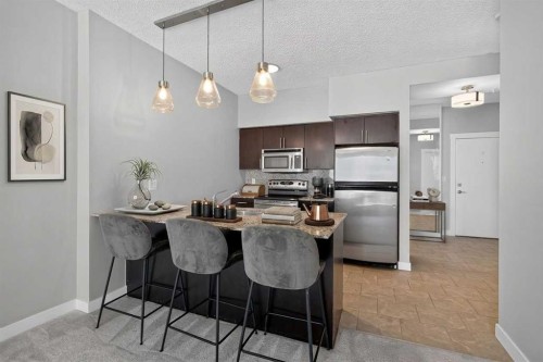 1205-8710 Horton Road Sw, Calgary, AB - Indoor Photo Showing Kitchen With Stainless Steel Kitchen