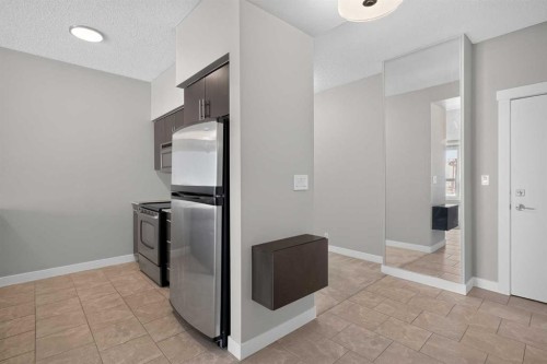 1205-8710 Horton Road Sw, Calgary, AB - Indoor Photo Showing Kitchen