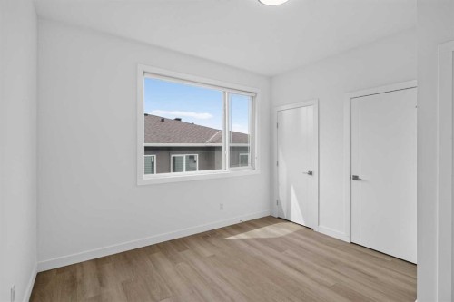 202-101 Panatella Square Nw, Calgary, AB - Indoor Photo Showing Other Room