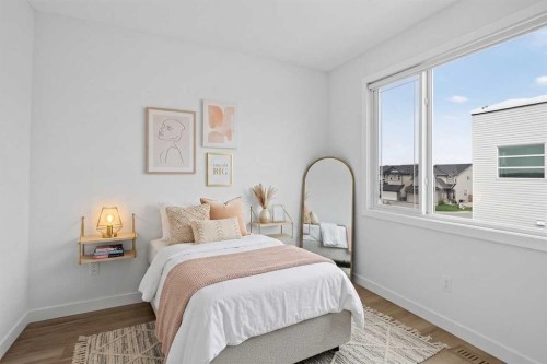 202-101 Panatella Square Nw, Calgary, AB - Indoor Photo Showing Bedroom