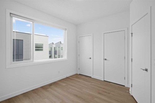 202-101 Panatella Square Nw, Calgary, AB - Indoor Photo Showing Other Room
