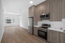 202-101 Panatella Square Nw, Calgary, AB  - Indoor Photo Showing Kitchen With Stainless Steel Kitchen 
