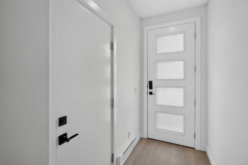 202-101 Panatella Square Nw, Calgary, AB - Indoor Photo Showing Other Room