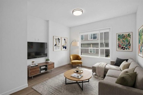 202-101 Panatella Square Nw, Calgary, AB - Indoor Photo Showing Living Room