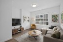 202-101 Panatella Square Nw, Calgary, AB  - Indoor Photo Showing Living Room 