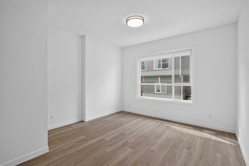 202-101 Panatella Square Nw, Calgary, AB - Indoor Photo Showing Other Room