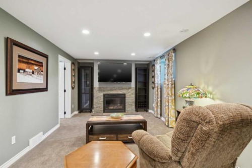 6111 Bow Crescent Nw, Calgary, AB - Indoor Photo Showing Living Room With Fireplace