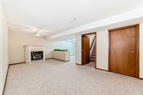 16 Edenwold Green Nw, Calgary, AB - Indoor With Fireplace