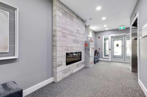 2310-3727 Sage Hill Drive Nw, Calgary, AB - Indoor With Fireplace