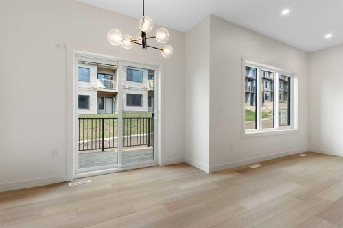 91 Heritage Manor, Cochrane, AB - Indoor Photo Showing Other Room