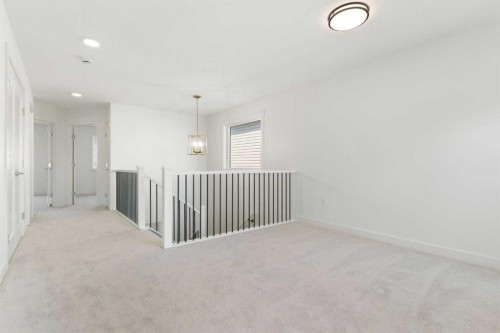 91 Heritage Manor, Cochrane, AB - Indoor Photo Showing Other Room