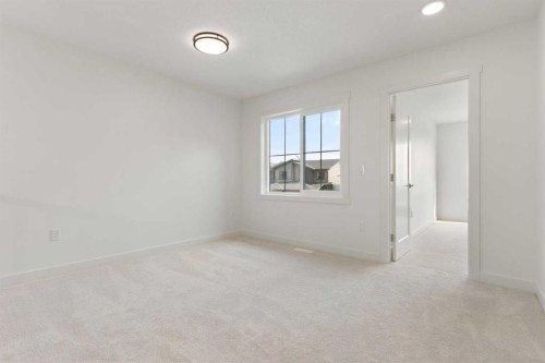 91 Heritage Manor, Cochrane, AB - Indoor Photo Showing Other Room