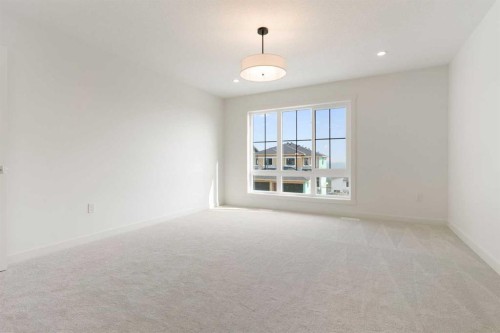 91 Heritage Manor, Cochrane, AB - Indoor Photo Showing Other Room