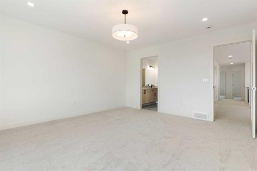 91 Heritage Manor, Cochrane, AB - Indoor Photo Showing Other Room