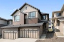 91 Heritage Manor, Cochrane, AB  - Outdoor With Facade 