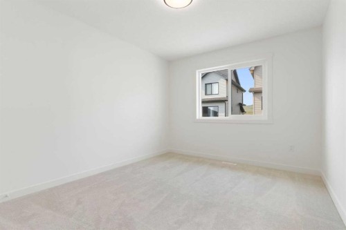 91 Heritage Manor, Cochrane, AB - Indoor Photo Showing Other Room