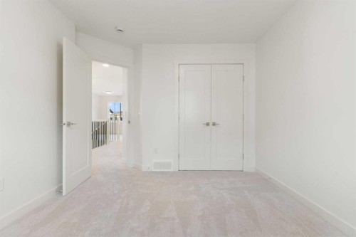 91 Heritage Manor, Cochrane, AB - Indoor Photo Showing Other Room