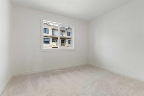 91 Heritage Manor, Cochrane, AB - Indoor Photo Showing Other Room