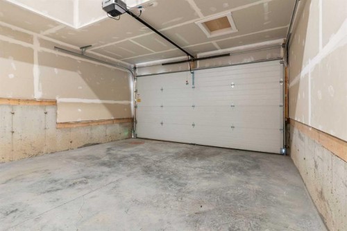 91 Heritage Manor, Cochrane, AB - Indoor Photo Showing Garage