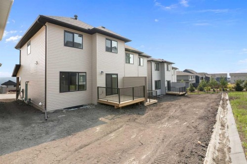 91 Heritage Manor, Cochrane, AB - Outdoor With Exterior
