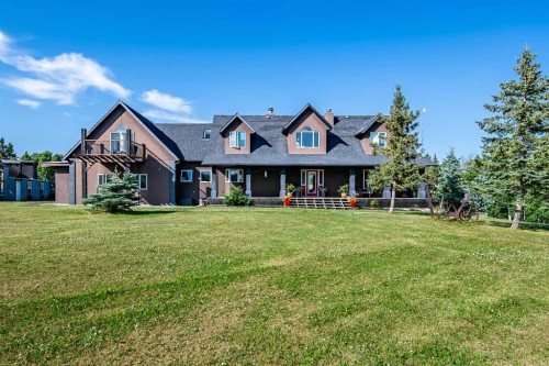 311068 Parkins Road West, Rural Foothills County, AB - Outdoor With Deck Patio Veranda With Facade
