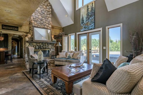 311068 Parkins Road West, Rural Foothills County, AB - Indoor Photo Showing Living Room With Fireplace