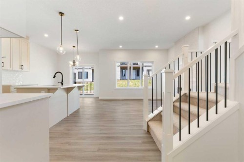 83 Heritage Manor, Cochrane, AB - Indoor Photo Showing Kitchen With Upgraded Kitchen