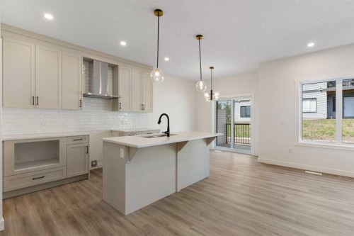 83 Heritage Manor, Cochrane, AB - Indoor Photo Showing Kitchen With Upgraded Kitchen