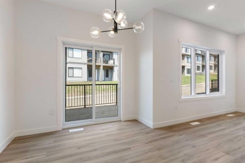 83 Heritage Manor, Cochrane, AB - Indoor Photo Showing Other Room