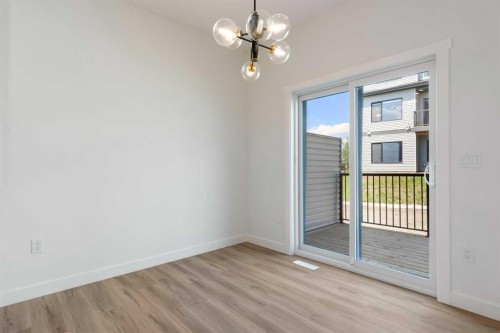 83 Heritage Manor, Cochrane, AB - Indoor Photo Showing Other Room
