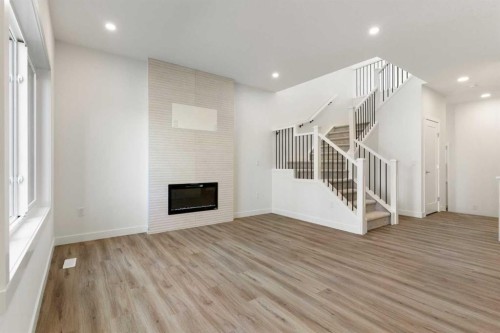 83 Heritage Manor, Cochrane, AB - Indoor With Fireplace