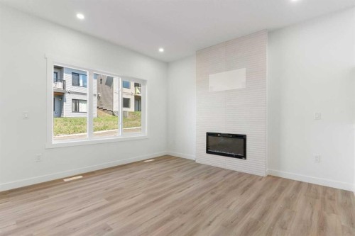83 Heritage Manor, Cochrane, AB - Indoor With Fireplace