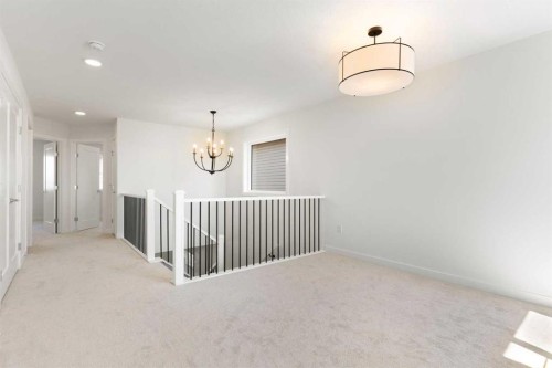 83 Heritage Manor, Cochrane, AB - Indoor Photo Showing Other Room
