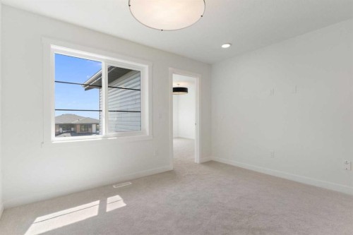 83 Heritage Manor, Cochrane, AB - Indoor Photo Showing Other Room