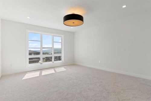 83 Heritage Manor, Cochrane, AB - Indoor Photo Showing Other Room