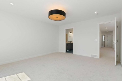 83 Heritage Manor, Cochrane, AB - Indoor Photo Showing Other Room