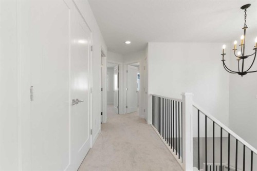 83 Heritage Manor, Cochrane, AB - Indoor Photo Showing Other Room