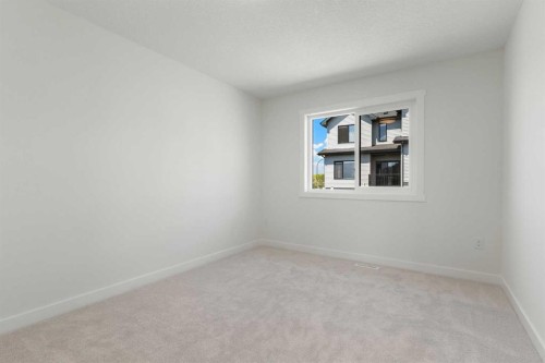 83 Heritage Manor, Cochrane, AB - Indoor Photo Showing Other Room