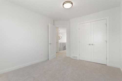 83 Heritage Manor, Cochrane, AB - Indoor Photo Showing Other Room