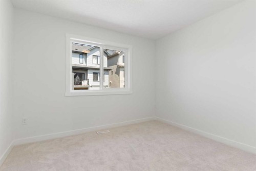 83 Heritage Manor, Cochrane, AB - Indoor Photo Showing Other Room