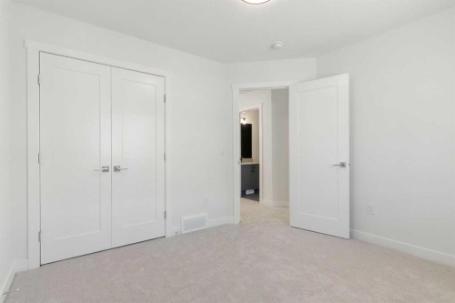 83 Heritage Manor, Cochrane, AB - Indoor Photo Showing Other Room