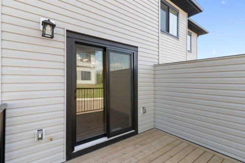 83 Heritage Manor, Cochrane, AB - Outdoor With Exterior