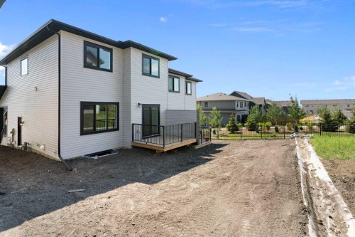 83 Heritage Manor, Cochrane, AB - Outdoor With Exterior