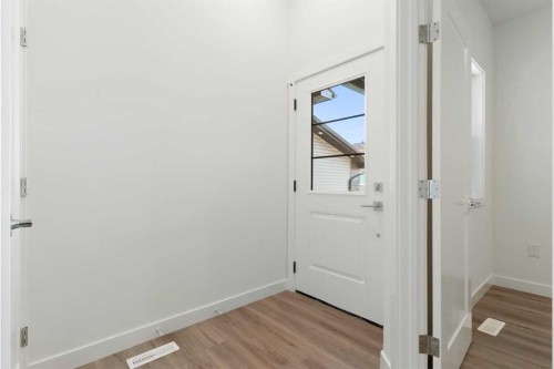 83 Heritage Manor, Cochrane, AB - Indoor Photo Showing Other Room